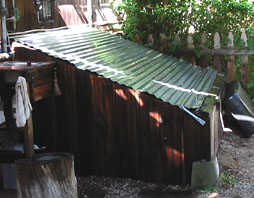 Compost bin along west wall